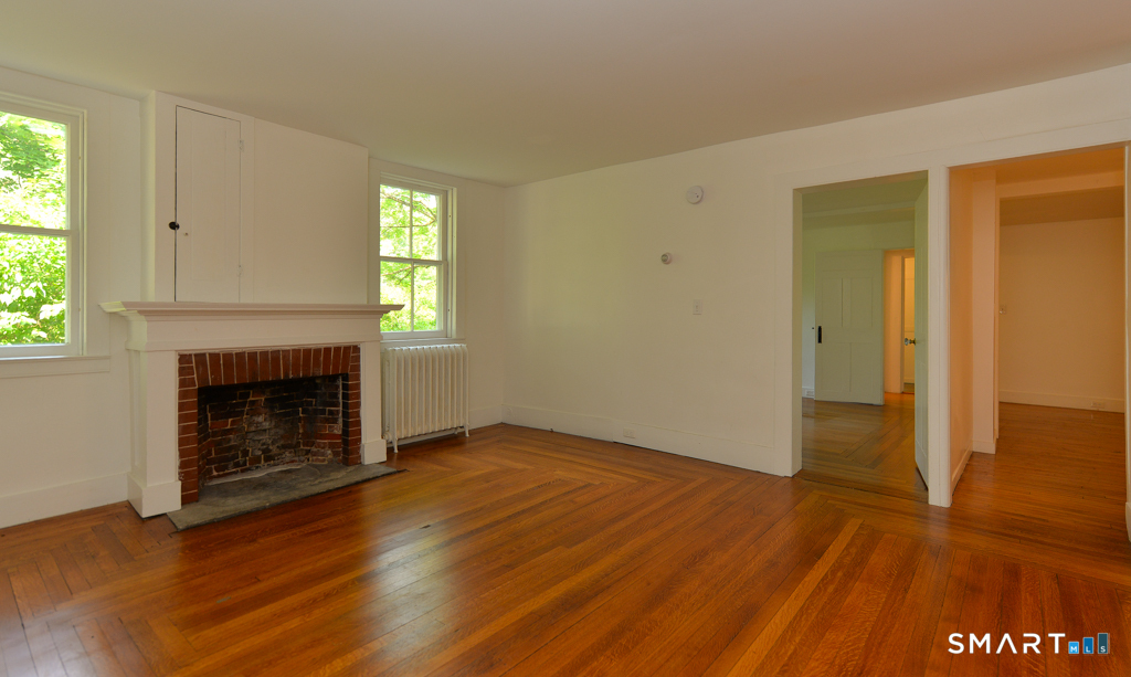 15 Hawkins Road Southbury, CT 06488 - Photo 4 of 26 a view of an empty room with window and fire place