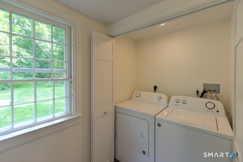 15 Hawkins Road Southbury, CT 06488 - Photo 8 of 26 a utility room with dryer and washer