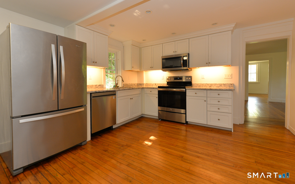 15 Hawkins Road Southbury, CT 06488 - Photo 9 of 26 a kitchen with stainless steel appliances granite countertop a refrigerator sink and stove