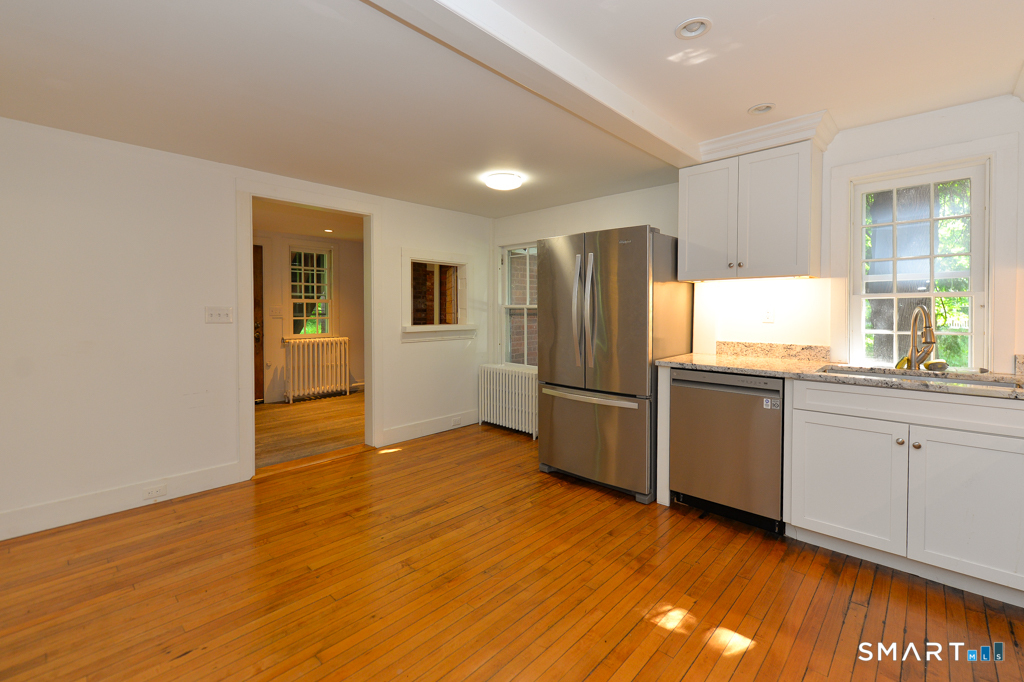 15 Hawkins Road Southbury, CT 06488 - Photo 10 of 26 a kitchen with granite countertop a refrigerator and a sink