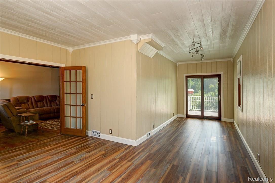 9675 Roberts Road Gregory, MI 48137 - Photo 24 of 33 Newly-refinished, large L-shaped room off living room; possible home office, den, bedroom? It's entirely up to you!