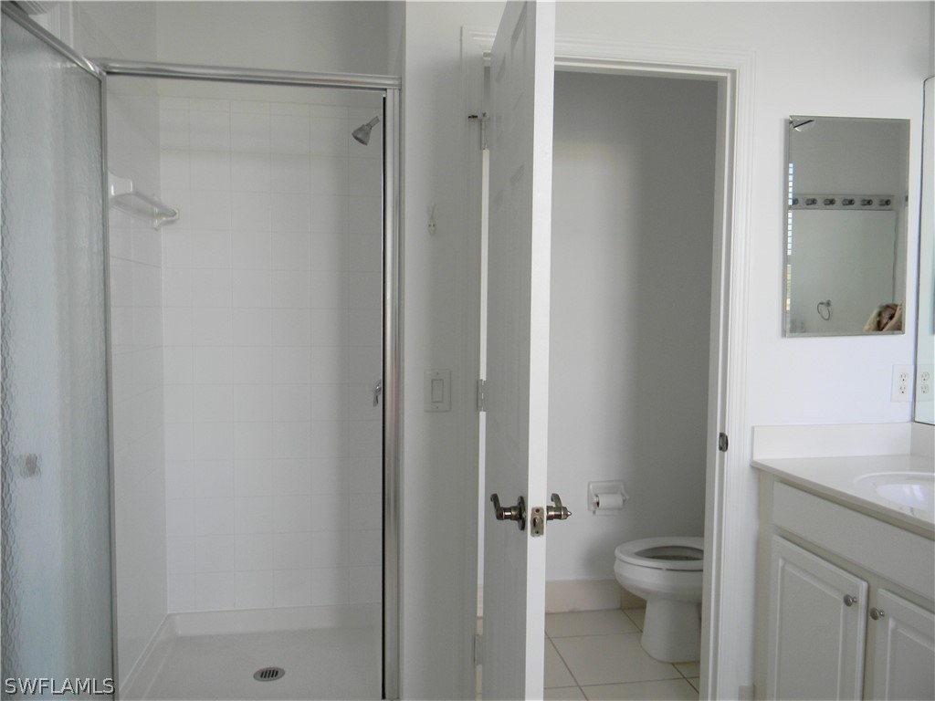 4109 Cherrybrook Loop Fort Myers, FL 33966 - Photo 16 of 32 a bathroom with a granite countertop sink toilet and shower