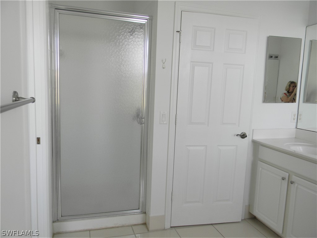 4109 Cherrybrook Loop Fort Myers, FL 33966 - Photo 17 of 32 a bathroom with a shower and a sink