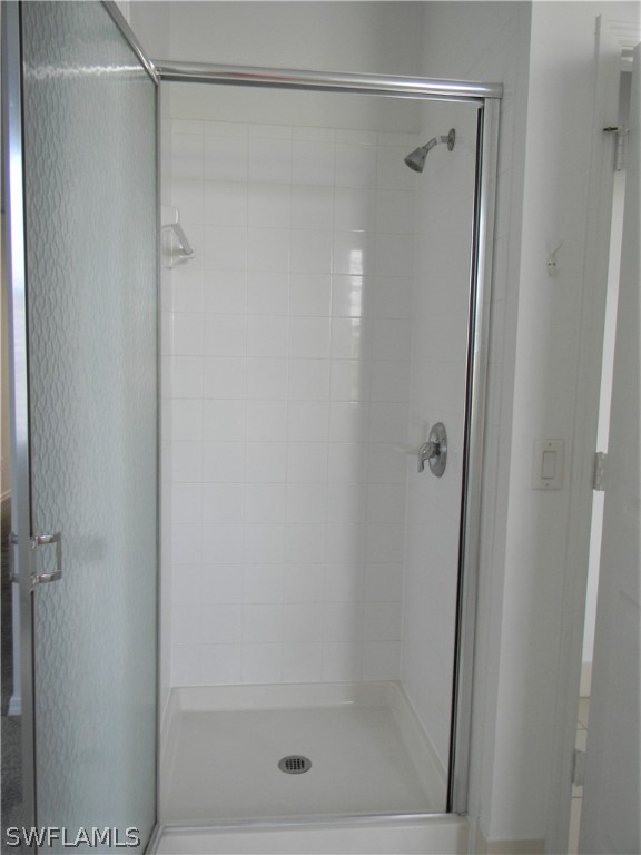 4109 Cherrybrook Loop Fort Myers, FL 33966 - Photo 18 of 32 a bathroom with a glass shower door