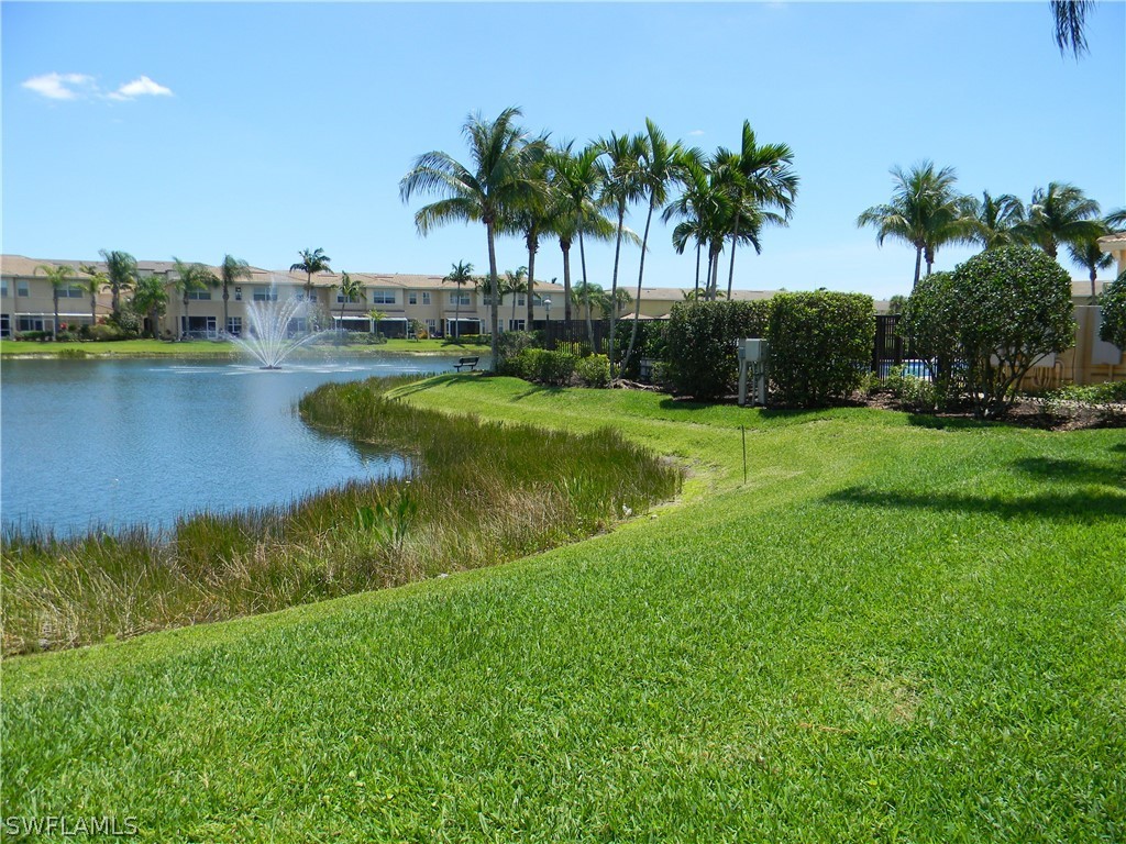 4109 Cherrybrook Loop Fort Myers, FL 33966 - Photo 2 of 32 a view of a house with a yard and a lake