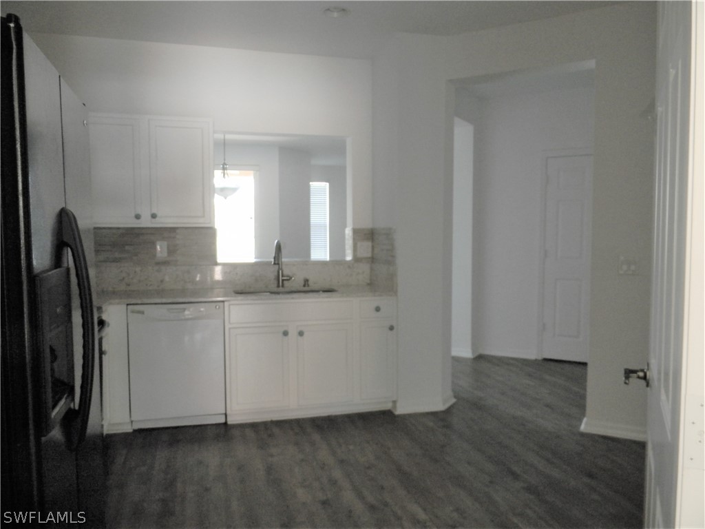 4109 Cherrybrook Loop Fort Myers, FL 33966 - Photo 6 of 32 a room with granite countertop cabinets and sink