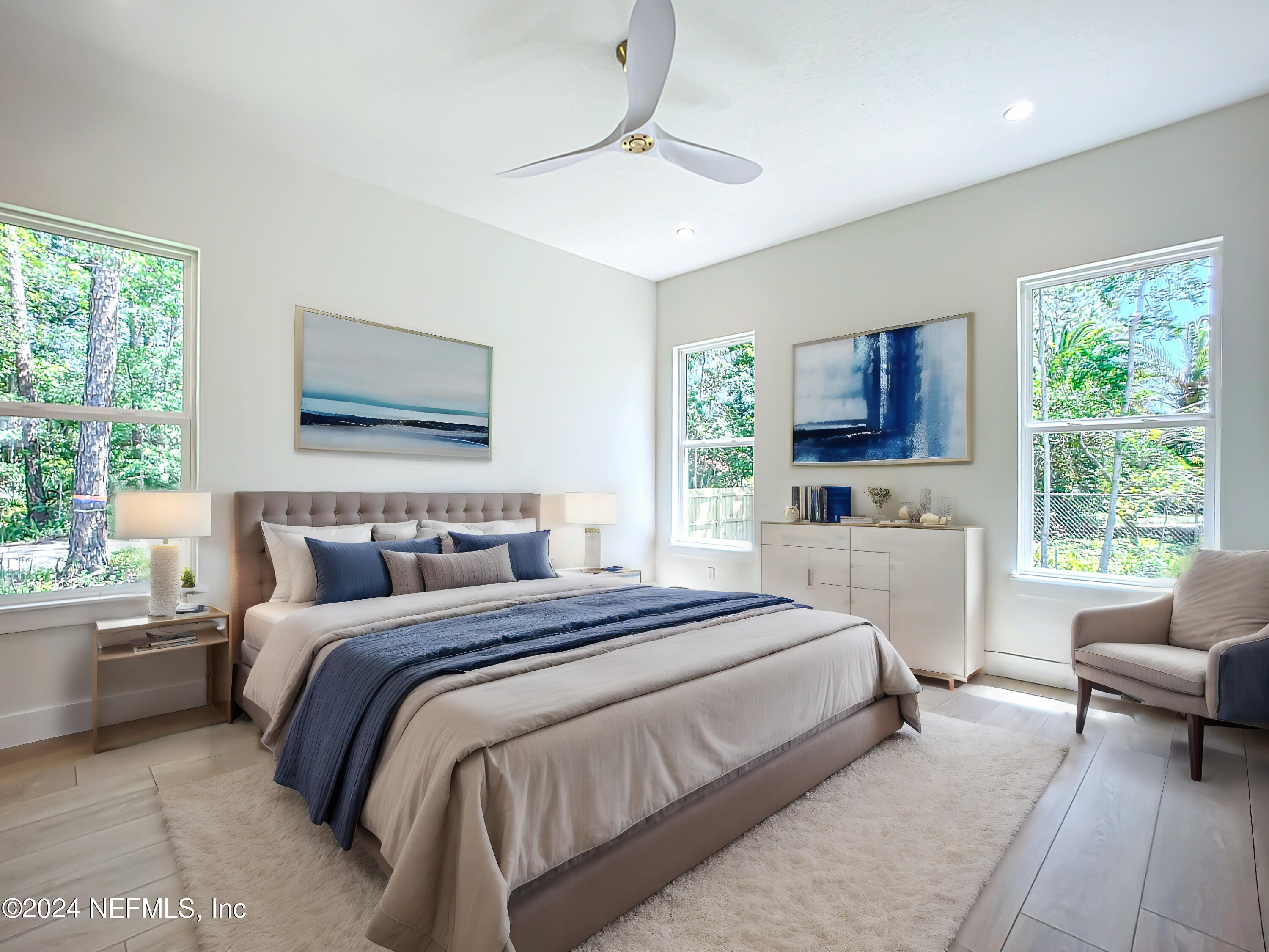 2903 Brougham Jacksonville, FL 32246 - Photo 21 of 40 a spacious bedroom with a bed a couch and a window