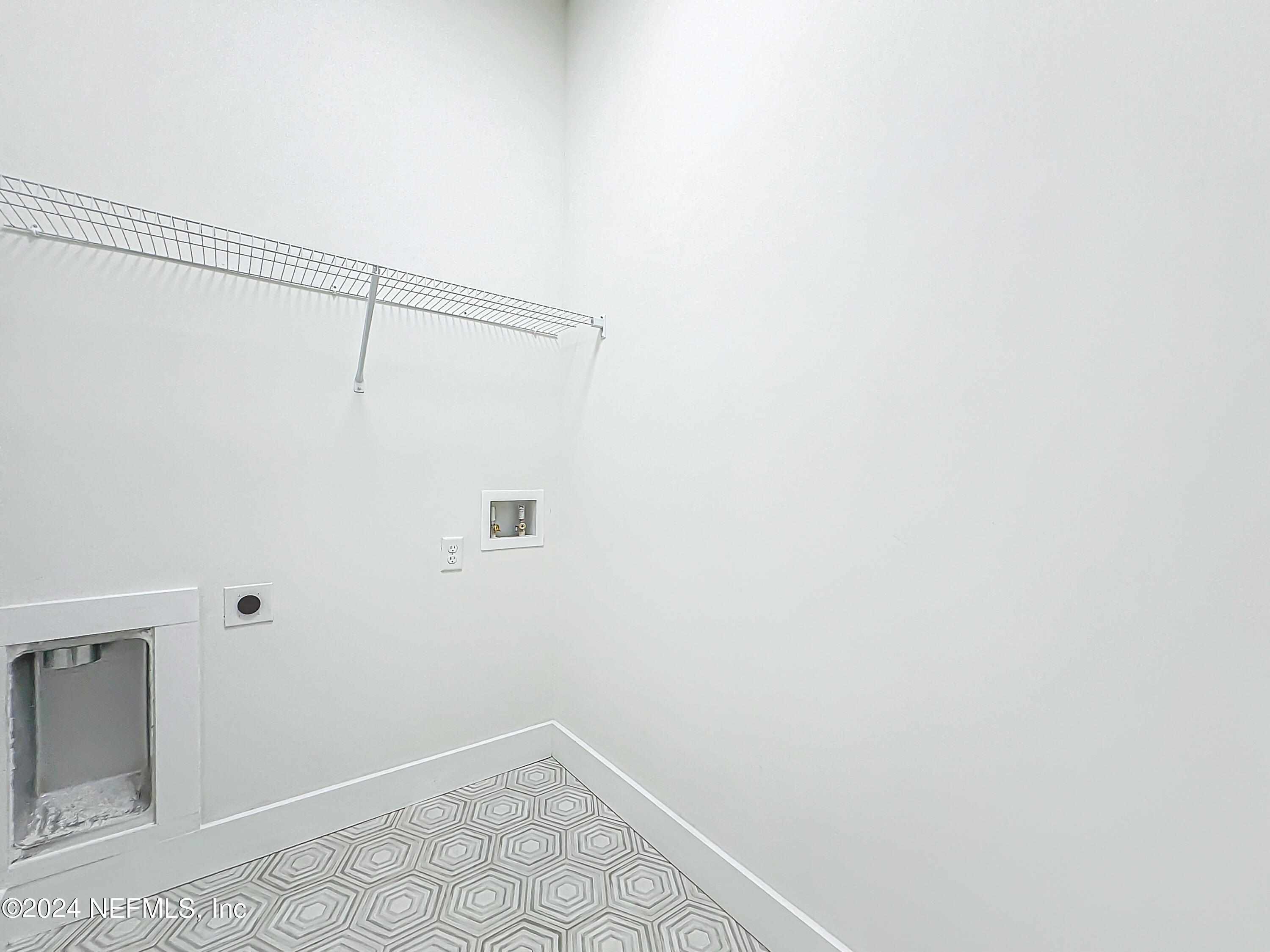 2903 Brougham Jacksonville, FL 32246 - Photo 29 of 40 a view of a room with racks on the wall