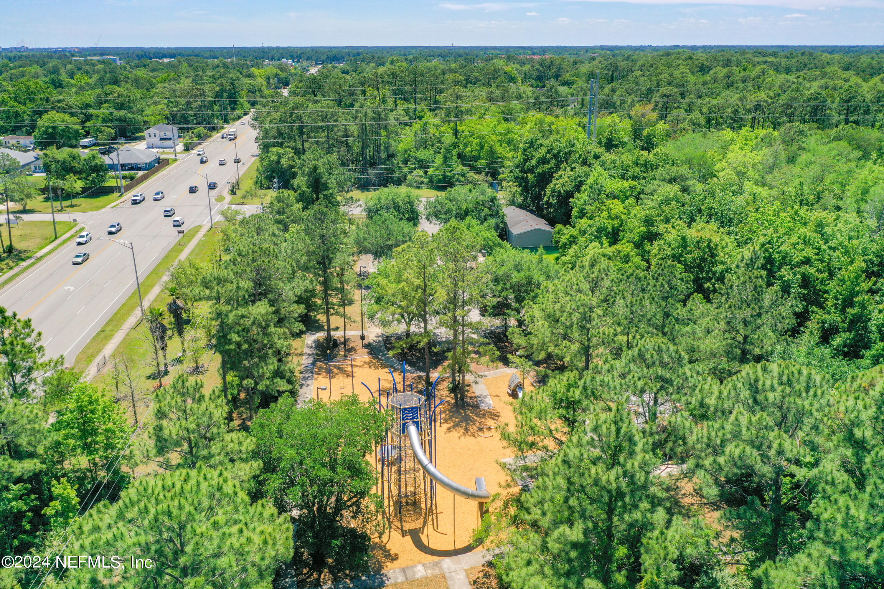 2903 Brougham Jacksonville, FL 32246 - Photo 35 of 40 a backyard of a house with lots of green space and fog