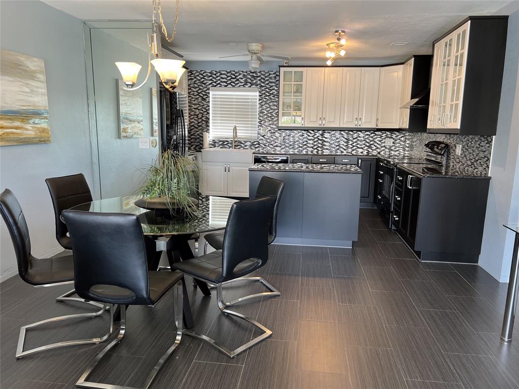 999 North Riverside Drive, Unit 9 Pompano Beach, FL 33062 - Photo 5 of 11 a view of a dining room with furniture and wooden floor