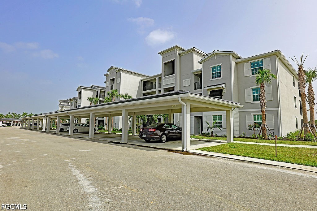 43997 Boardwalk Loop, Unit 1843 Punta Gorda, FL 33982 - Photo 1 of 11 front view of a building with a street
