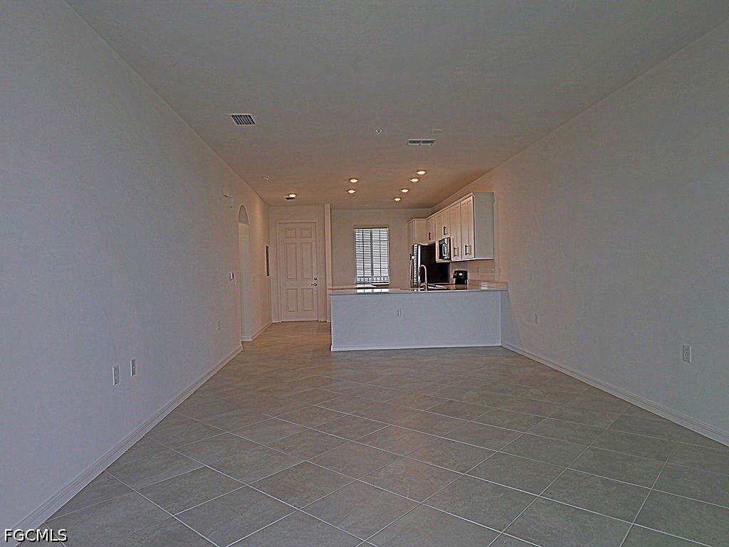 43997 Boardwalk Loop, Unit 1843 Punta Gorda, FL 33982 - Photo 4 of 11 a view of a kitchen with a sink and a refrigerator