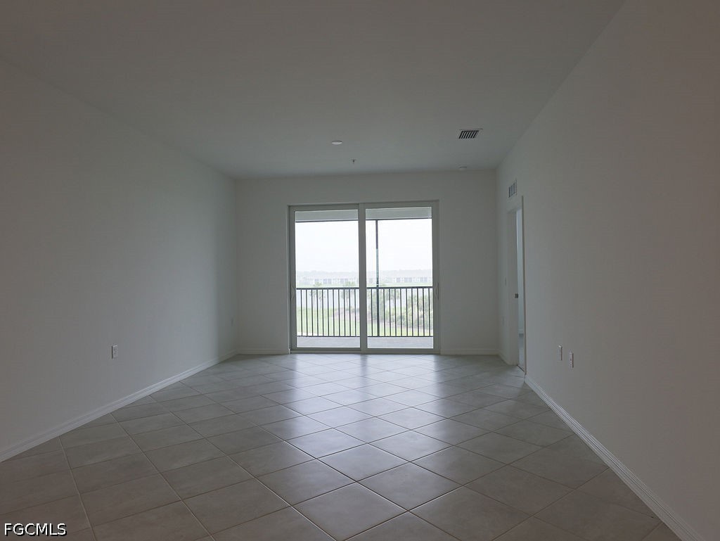 43997 Boardwalk Loop, Unit 1843 Punta Gorda, FL 33982 - Photo 5 of 11 a view of an empty room with a window