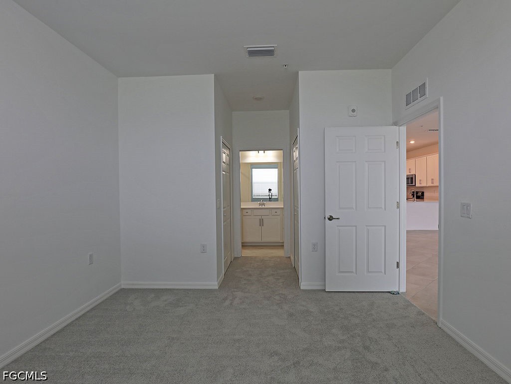 43997 Boardwalk Loop, Unit 1843 Punta Gorda, FL 33982 - Photo 9 of 11 a view of an empty room and closet area