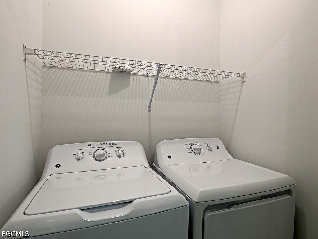 43997 Boardwalk Loop, Unit 1843 Punta Gorda, FL 33982 - Photo 10 of 11 a utility room with dryer and washer