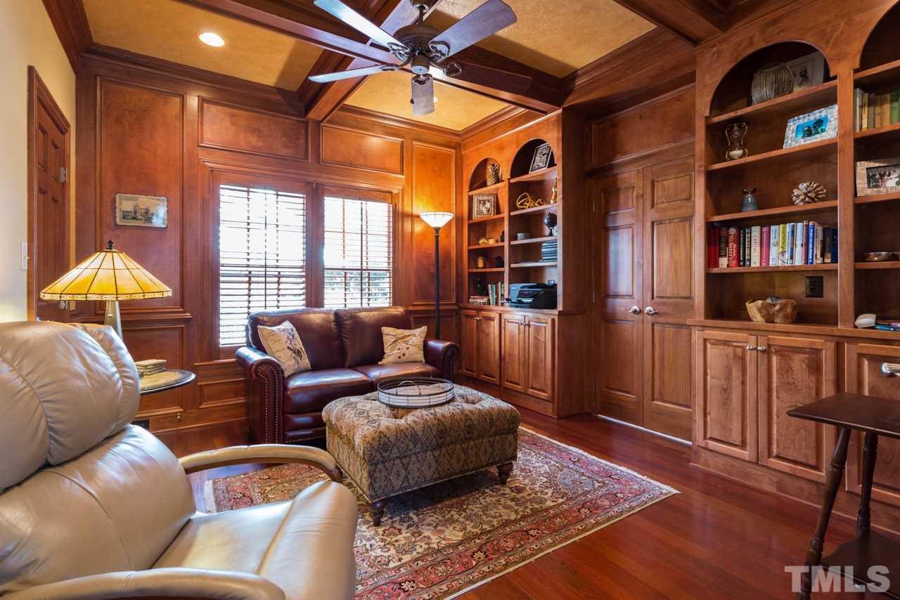 12528 Bayleaf Church Road Raleigh, NC 27614 - Photo 9 of 30 Custom Bookcases, Coffered Ceiling, Walk-in Storage Closet, and Hardwood Floors