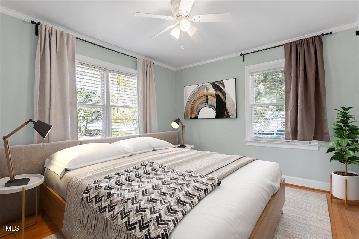 5707 Old Stage Road Raleigh, NC 27603 - Photo 13 of 50 a bedroom with a large bed and a window