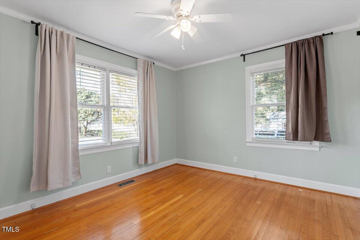 5707 Old Stage Road Raleigh, NC 27603 - Photo 30 of 50 a view of an empty room with wooden floor and a window