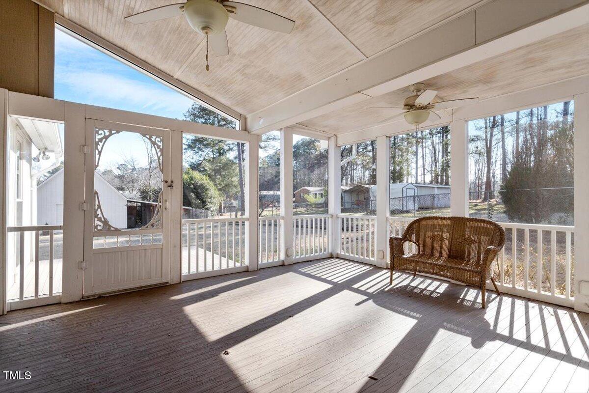 5707 Old Stage Road Raleigh, NC 27603 - Photo 37 of 50 a living room with furniture and a floor to ceiling window