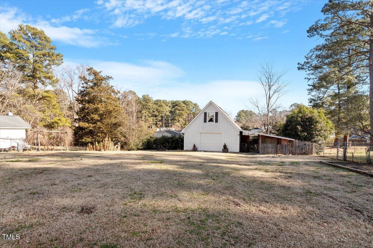 5707 Old Stage Road Raleigh, NC 27603 - Photo 41 of 50 a view of a house with a snow in the yard