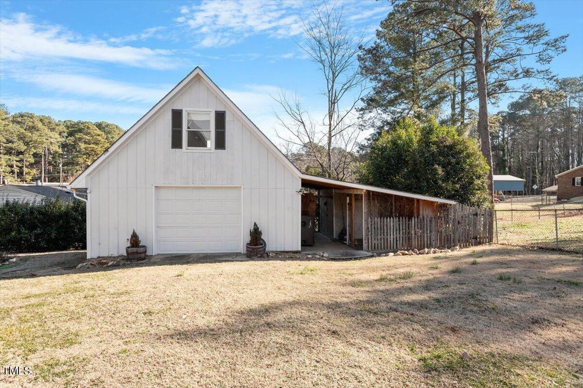 5707 Old Stage Road Raleigh, NC 27603 - Photo 42 of 50 a view of wooden house with a yard