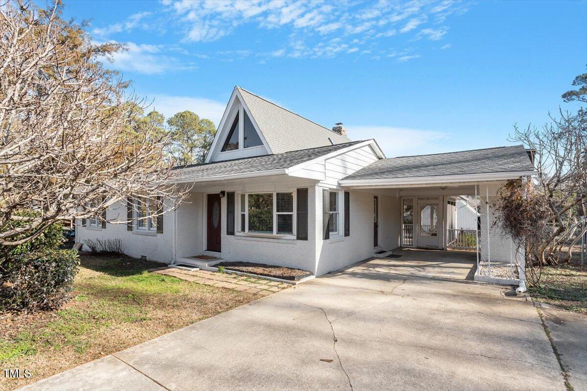 5707 Old Stage Road Raleigh, NC 27603 - Photo 44 of 50 a front view of a house with a garden