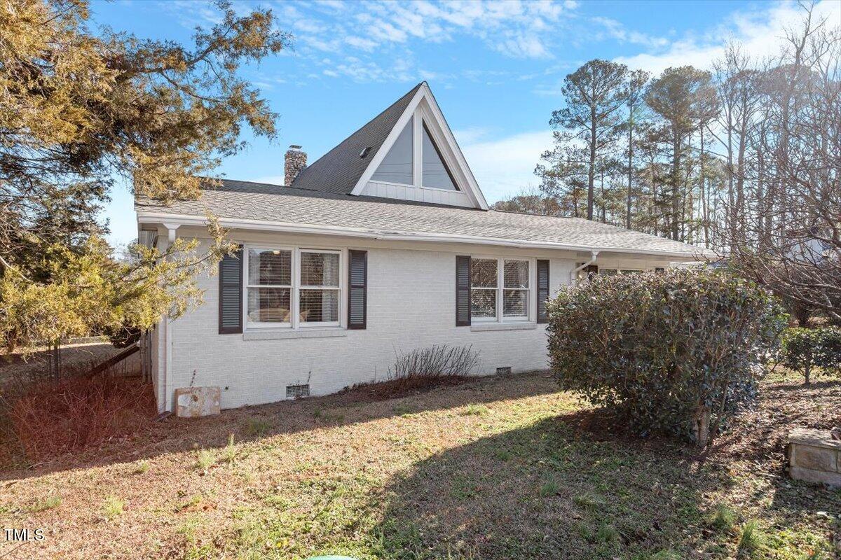 5707 Old Stage Road Raleigh, NC 27603 - Photo 45 of 50 a house with trees in the background