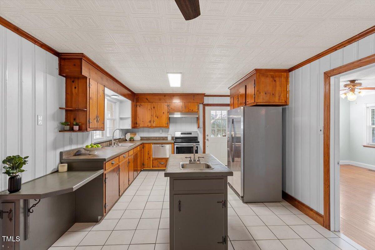 5707 Old Stage Road Raleigh, NC 27603 - Photo 7 of 50 a kitchen with stainless steel appliances granite countertop a refrigerator and a sink