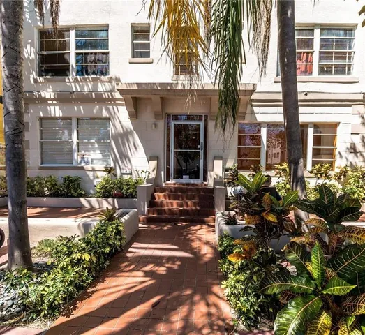 a view of a house with sitting area and garden