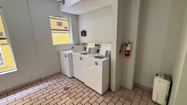 a utility room with a window dryer and washer