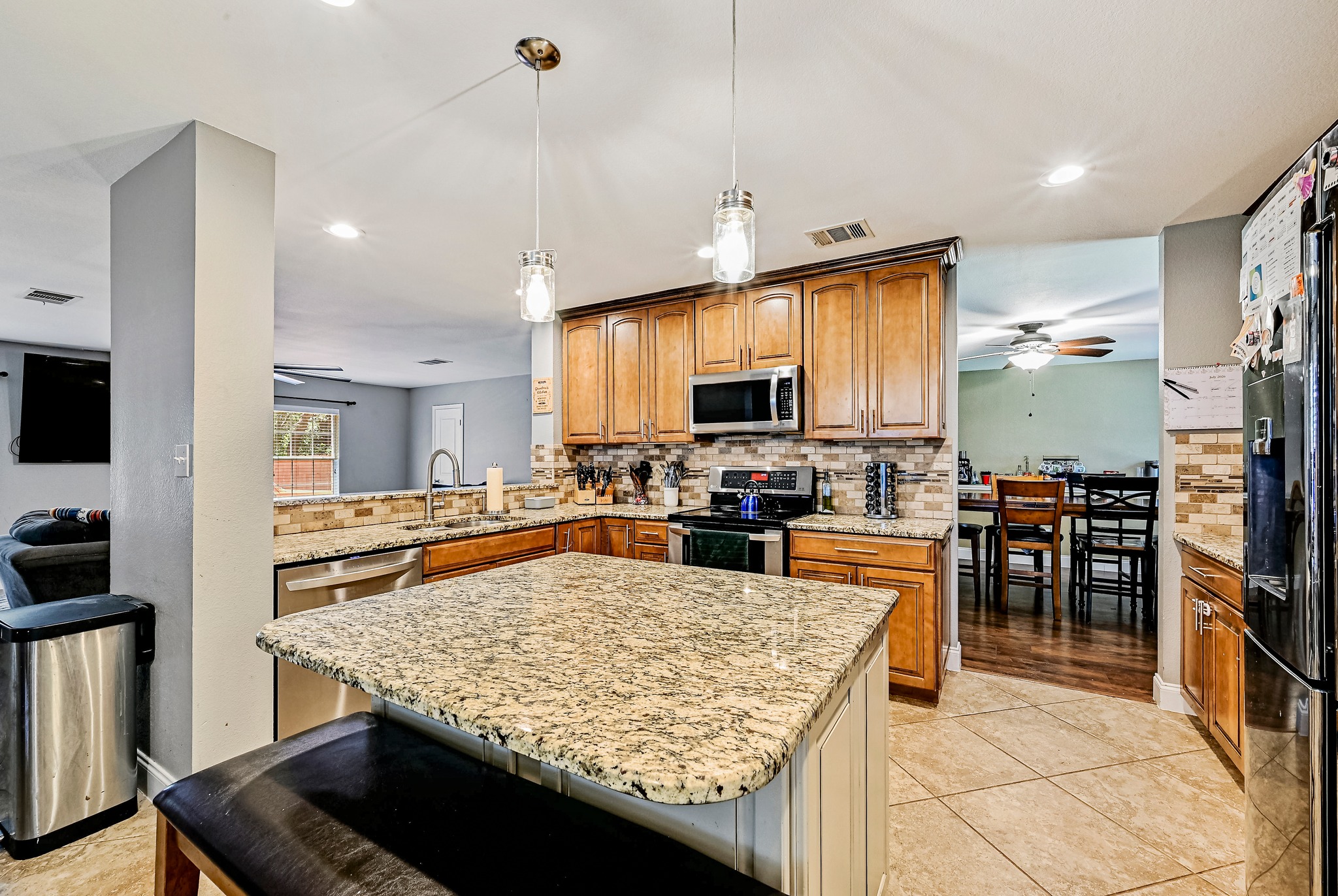 104 North Sumac Lane Georgetown, TX 78633 - Photo 17 of 40 A well-appointed kitchen features a spacious island and gleaming stainless steel appliances.