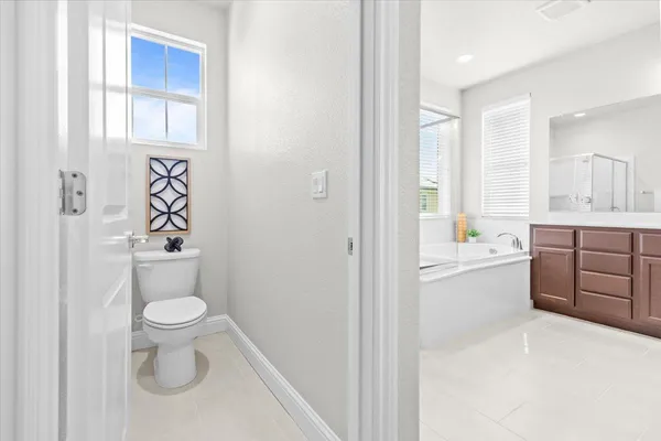 a bathroom with a toilet sink and a bathtub