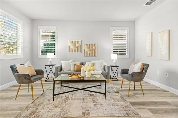 a living room with furniture and a window