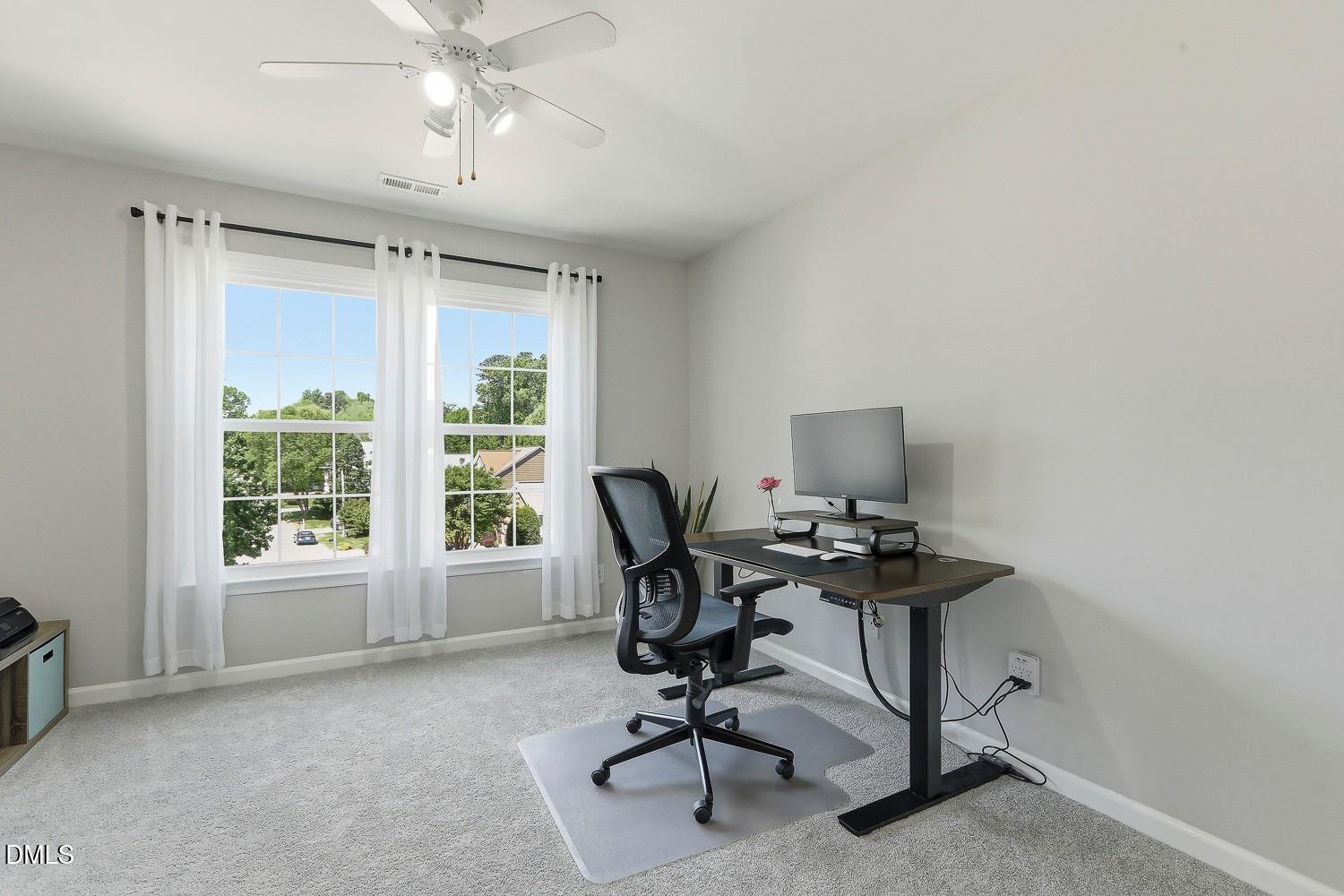 4001 Batiste Road Raleigh, NC 27613 - Photo 37 of 63 a view of a workspace with furniture and a window