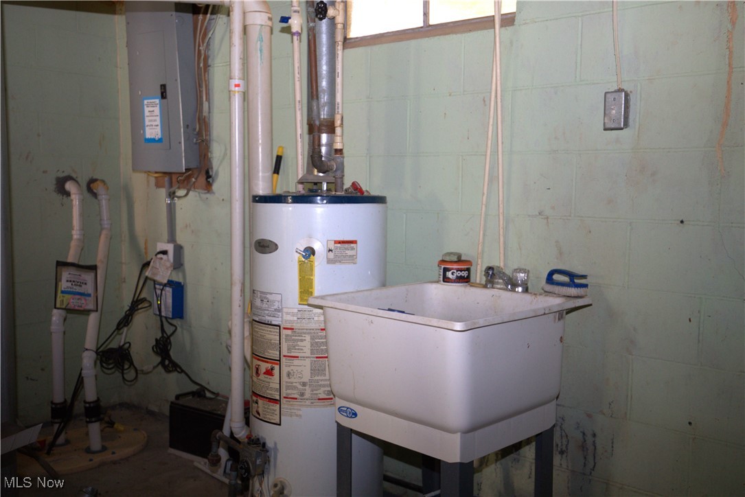 22760 Roy Croy Road Senecaville, OH 43780 - Photo 29 of 46 Utility room with water heater and electric panel