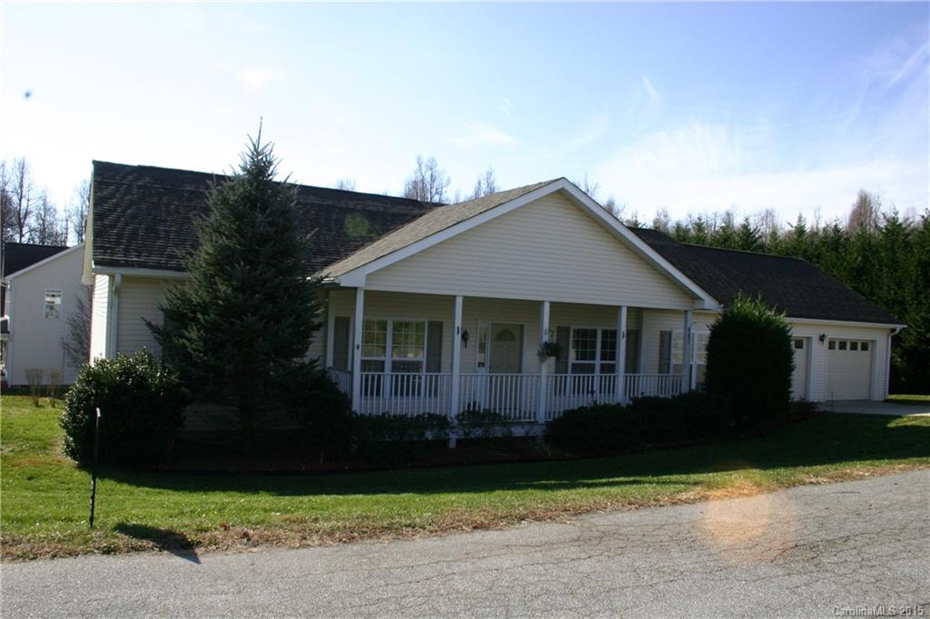 441 Cedarview Lane Saluda, NC 28773 - Photo 2 of 2 a front view of a house with a garden