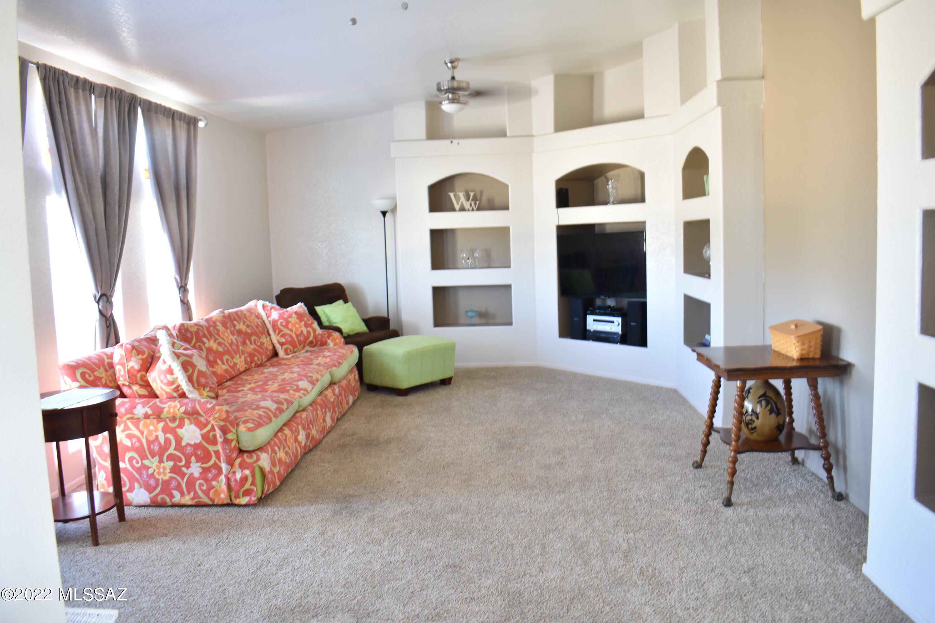 13643 East Bright Sky Loop Vail, AZ 85641 - Photo 13 of 22 a living room with furniture and a large window