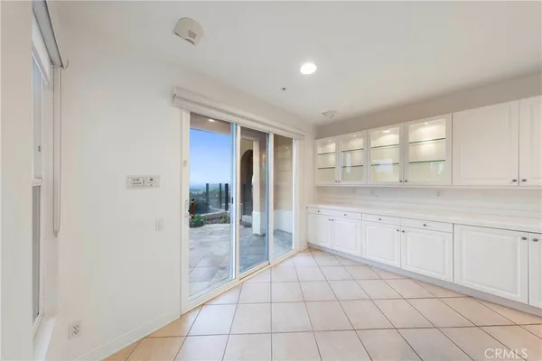 a large white bathroom with a granite countertop sink