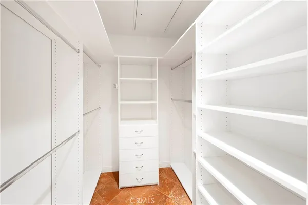a bathroom with a bathtub shower sink and mirror