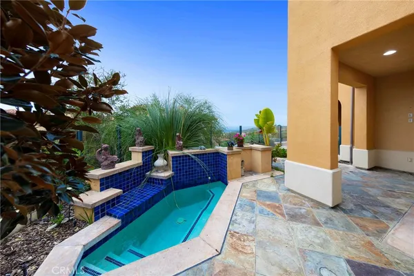 a view of a swimming pool with a patio