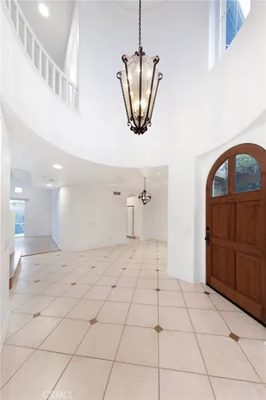 a view of a hallway with a chandelier