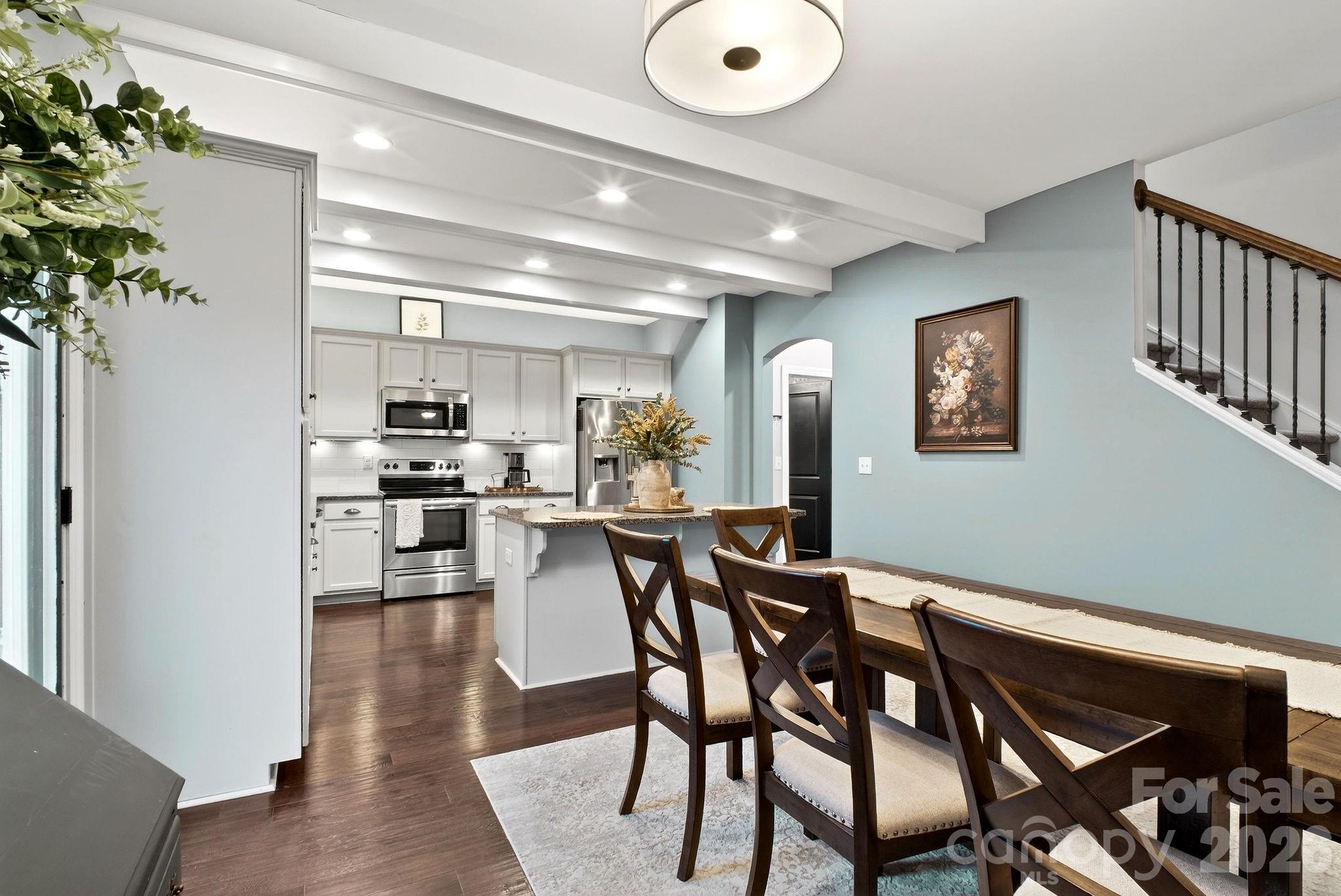 9092 Pitcairn Drive Fort Mill, SC 29708 - Photo 13 of 47 a view of a dining room with furniture and wooden floor