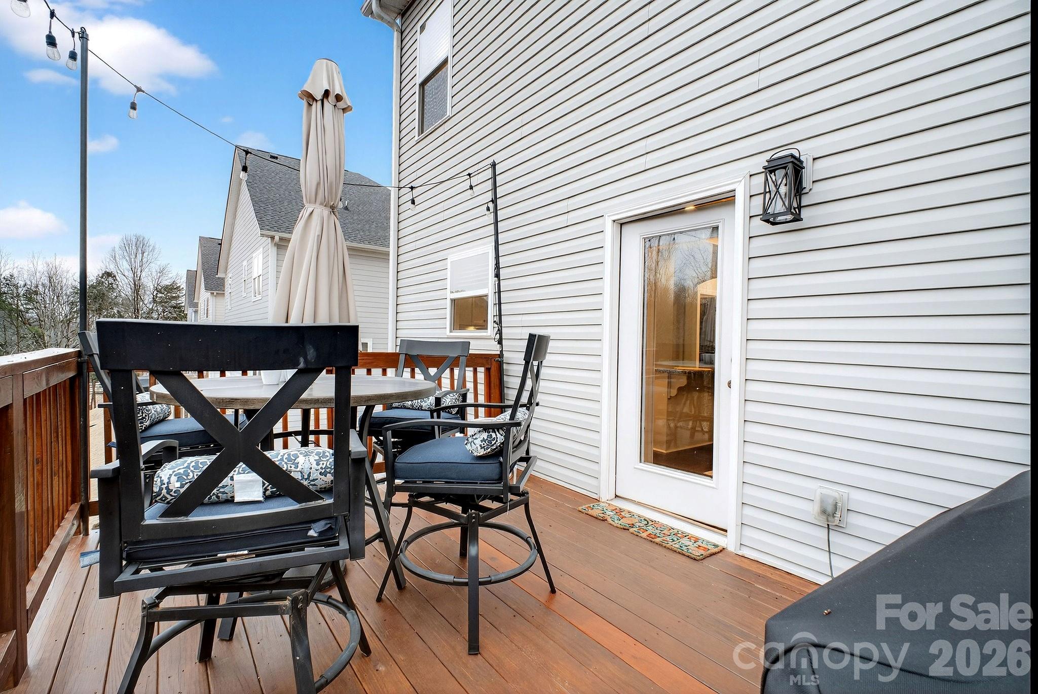 9092 Pitcairn Drive Fort Mill, SC 29708 - Photo 20 of 47 a view of a patio with table and chairs and wooden floor
