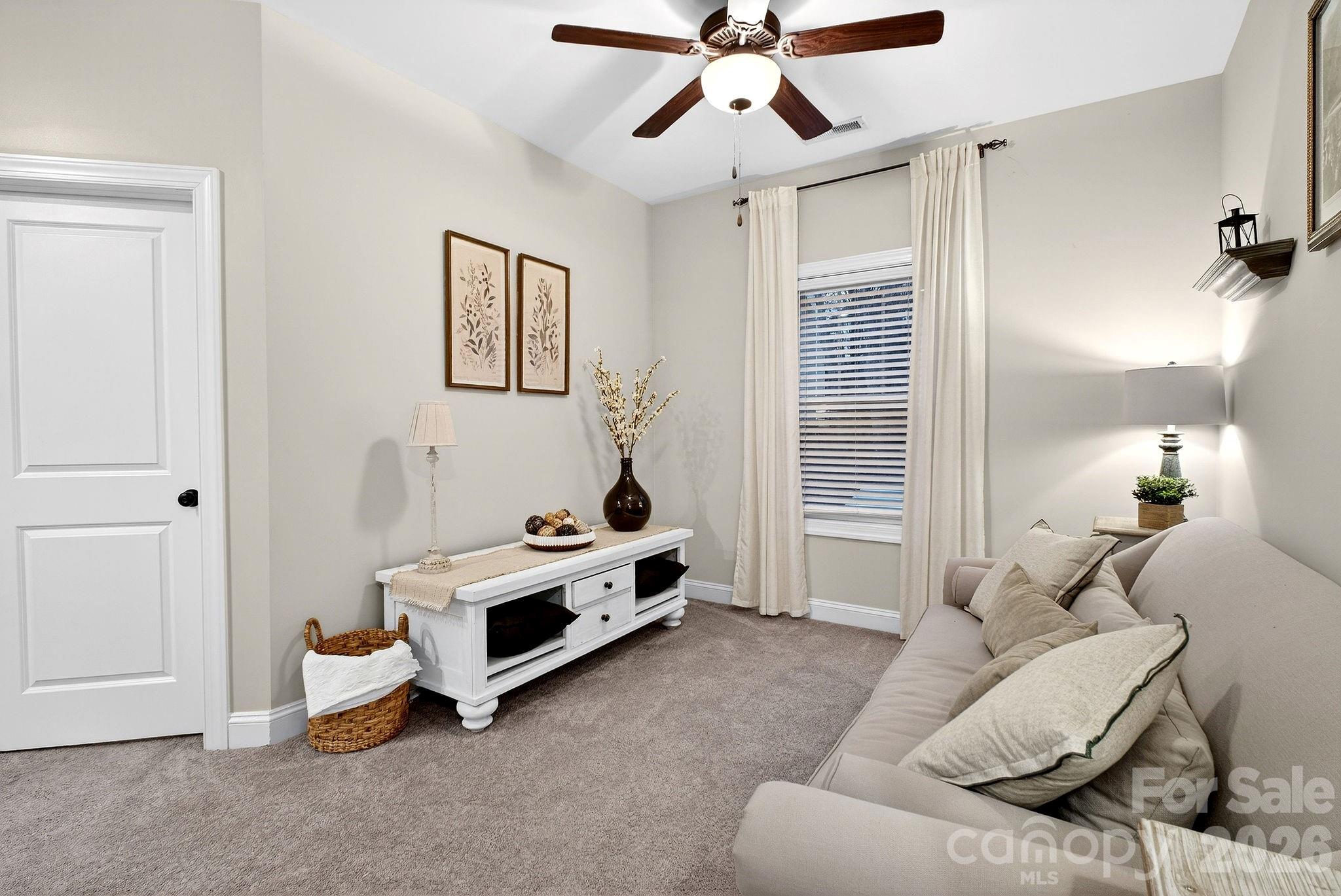 9092 Pitcairn Drive Fort Mill, SC 29708 - Photo 33 of 47 a bedroom with furniture and a window