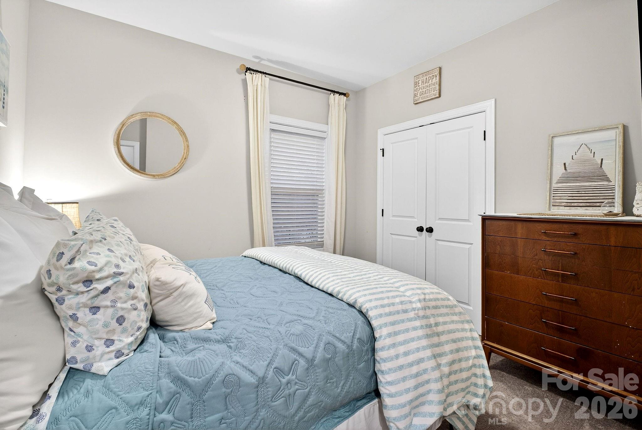 9092 Pitcairn Drive Fort Mill, SC 29708 - Photo 35 of 47 a bedroom with a bed and a dresser
