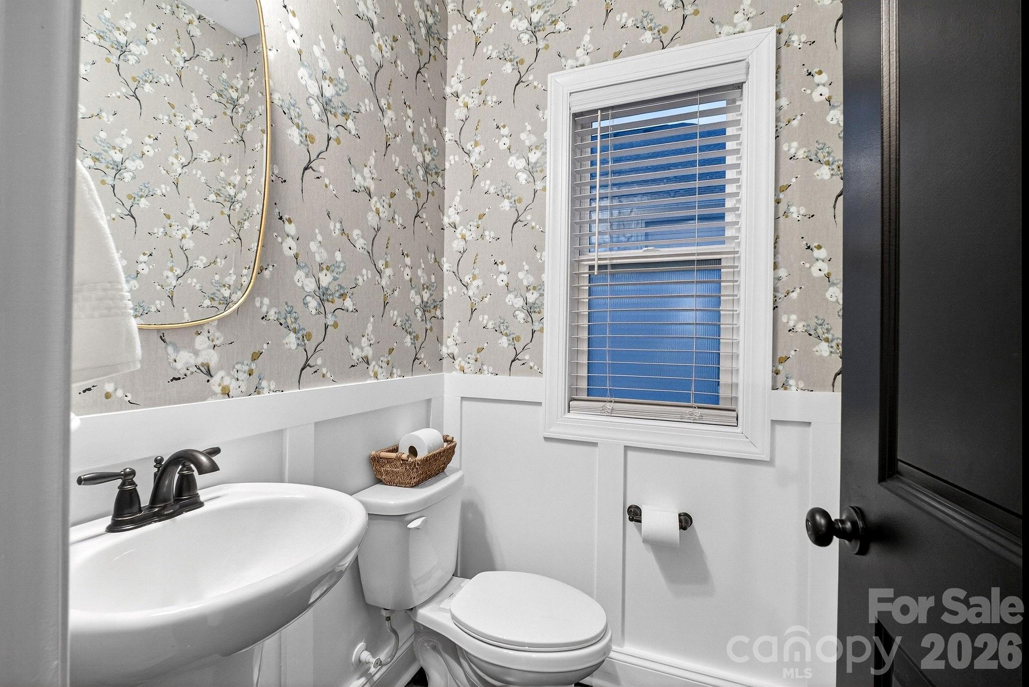 9092 Pitcairn Drive Fort Mill, SC 29708 - Photo 39 of 47 a bathroom with a toilet sink and mirror