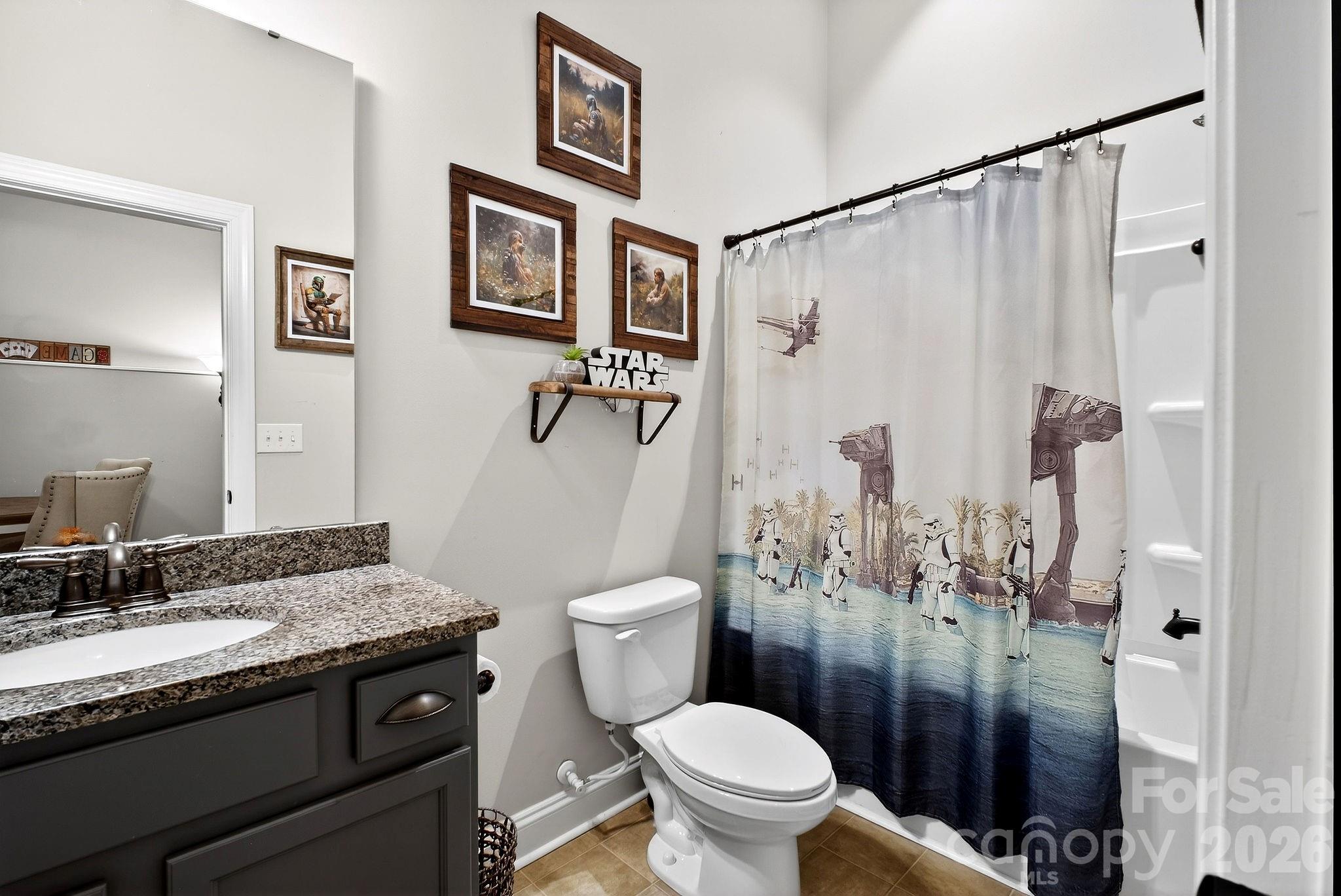 9092 Pitcairn Drive Fort Mill, SC 29708 - Photo 45 of 47 a bathroom with a granite countertop sink toilet and shower