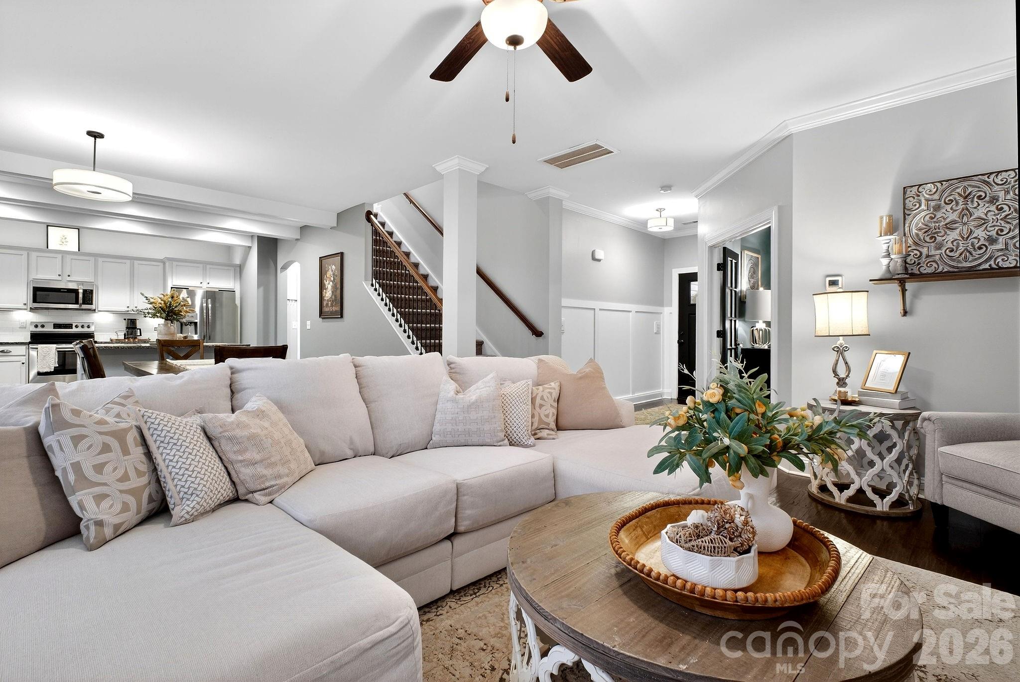 9092 Pitcairn Drive Fort Mill, SC 29708 - Photo 10 of 47 a living room with furniture potted plant and a chandelier
