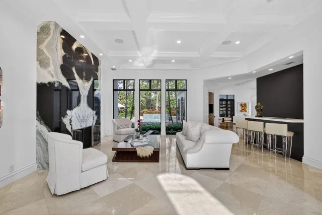 a view of staircase with white walls and a rug