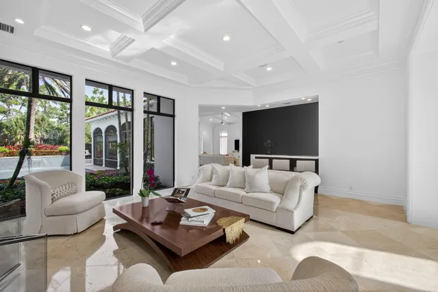 a bedroom with a bed and a mirror